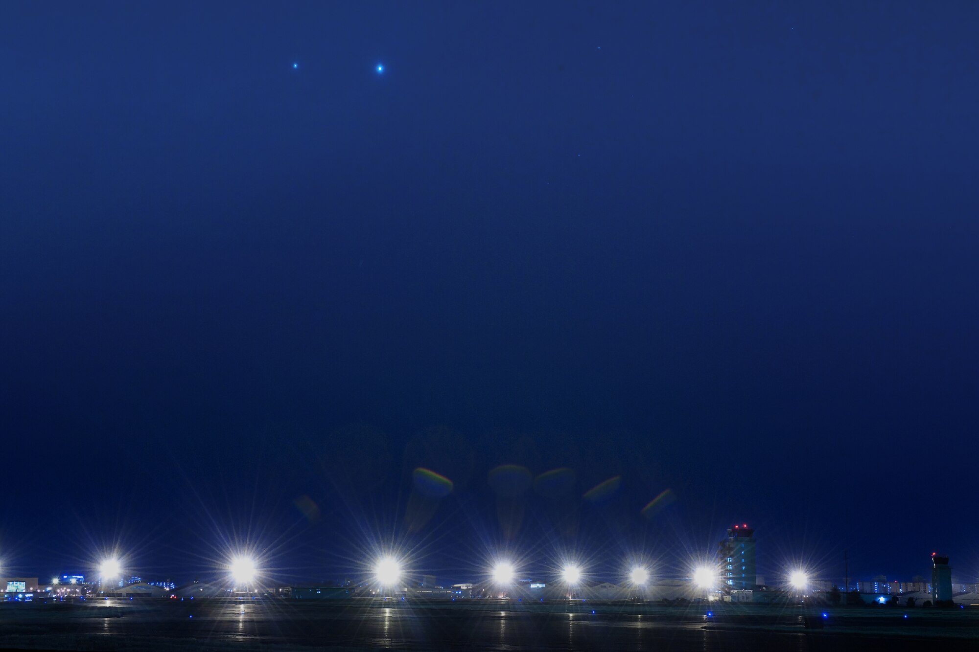 YOKOTA AIR BASE, Japan -- In this photo taken from Yokota field on the eastside, the brightest and second-brightest plants, Venus (right) and Jupiter come together for stunning conjunction March 13, 2012 at Yokota Air Base, Japan.  A conjunction occurs when two or more plants appear close together in the sky. (U.S. Air Force photo/Osakabe Yasuo)