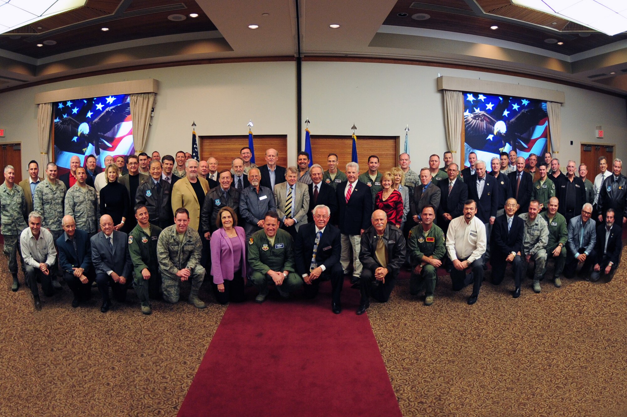 Members of the Nellis Support Team and new honorary commanders pose for a group photo during a commander's call at Nellis Air Force Base, March 9, 2012.  Leaders from across the Las Vegas valley gathered to hear the latest regarding Nellis and Creech Air Force Bases and the Nevada Test and Training Range. (U.S. Air Force photo by Staff Sgt. William P.Coleman)