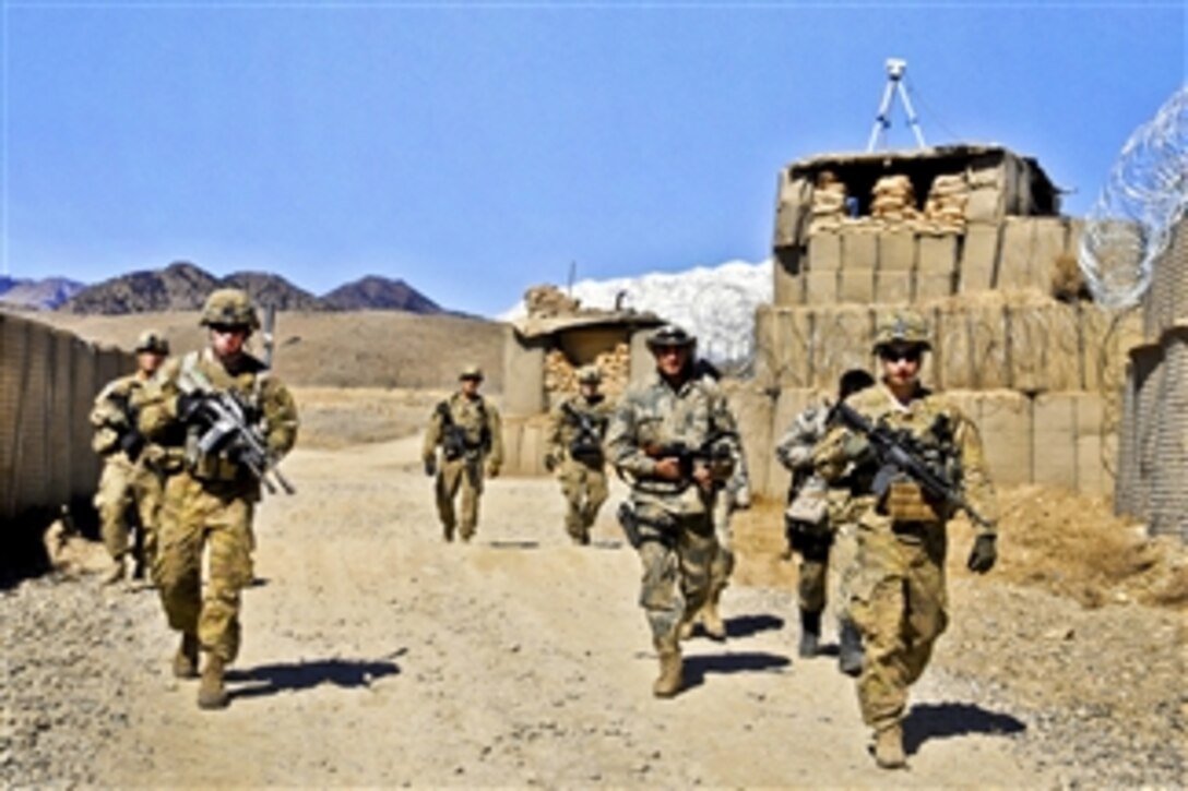 U.S. Army soldiers prepare to conduct security checks near the Pakistan border at Combat Outpost Dand Patan in Afghanistan's Paktya province on Feb. 29, 2012.  The soldiers are paratroopers assigned to Company A, 3rd Battalion, 509th Infantry Regiment.  