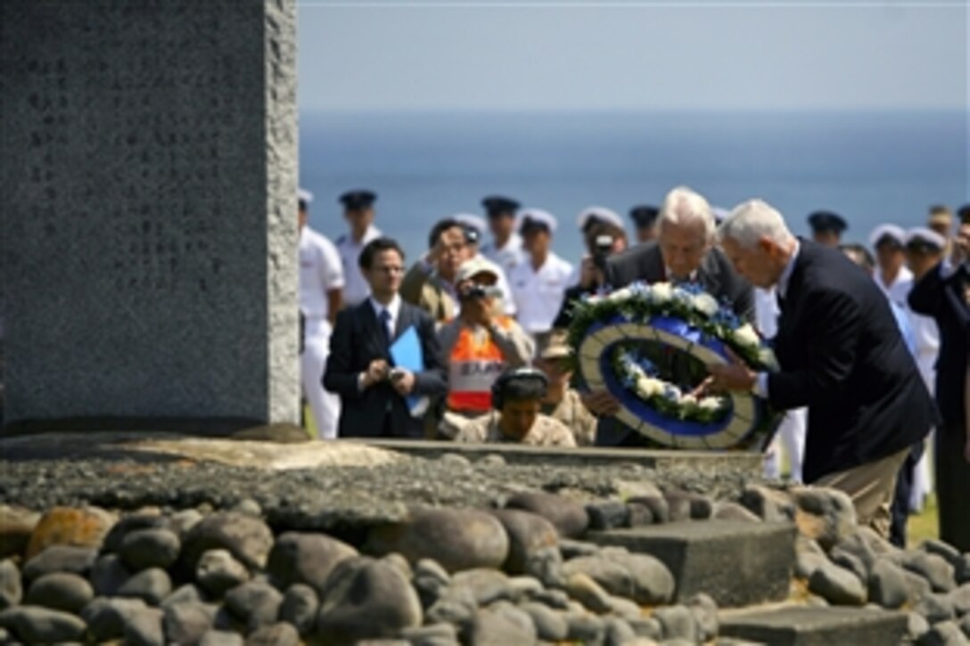 Retired Marine Corps Lt. Gens. Lawrence F. Snowden and Henry C. Stackpole III lay a wreath on the Reunion of Honor memorial on Iwo Jima during the 67th Iwo Jima Reunion of Honor ceremony, March 14, 2012. The Battle of Iwo Jima lasted for 36 days. The reunion was coordinated by the Iwo Jima Associations of America and Japan with help from the Japanese Ministry of Foreign Affairs and the U.S. Marine Corps. Snowden is the chairman of the Iwo Jima Association of America.