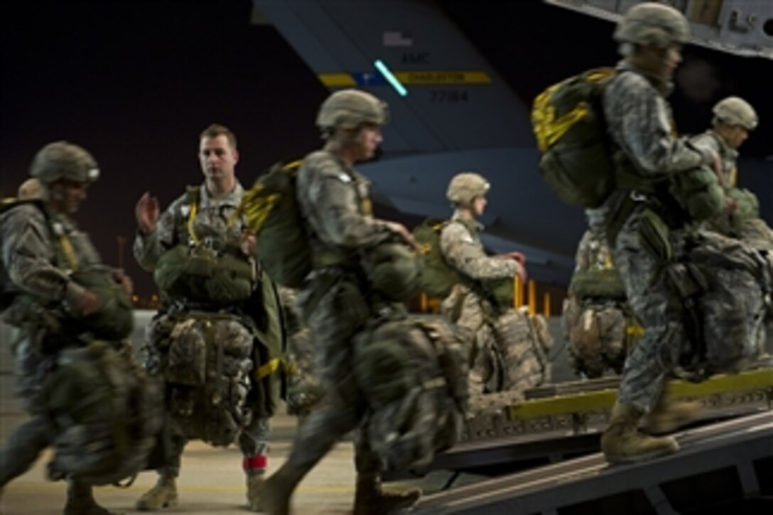 U.S. Army soldiers with the 6th Military Information Support Battalion, 82nd Airborne Division participate in a joint operational access exercise at Fort Bragg, N.C., on Feb. 8, 2012.  The joint airdrop exercise is designed to enhance service cohesiveness between U.S. Army and Air Force personnel, allowing both services an opportunity to properly execute large-scale heavy equipment and troop movement.  