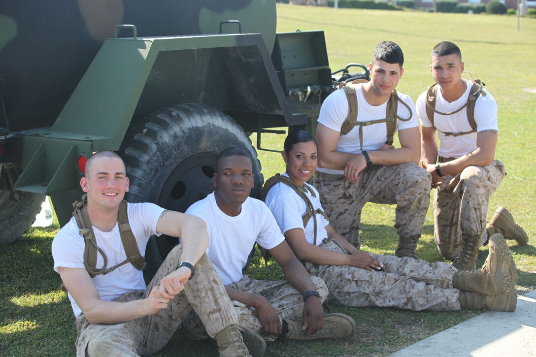 Marines take a few moments to rest during the annual Saint Patrick’s Day Field Meet on Ellis Field in Courthouse Bay, March 15, aboard Marine Corps Base Camp Lejeune. The event had refreshments and food available. ::r::::n::::r::::n::