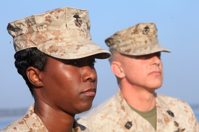 Sergeants Major Lanette N. Wright (left) and Michael W. Redmeyer stand before a formation during an appointment and relief ceremony in which Redmeyer transferred authority as sergeant major of Combat Logistics Regiment 27, 2nd Marine Logistics Group to Wright March 15, 2012. Wright, who has been with 2nd MLG for more than a year already, said she was looking forward to working with the Marines and sailors of CLR-27.  (U.S. Marine Corps photo by Cpl. Katherine M. Solano)