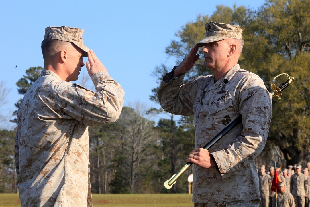 Sgt. Maj. Michael W. Redmeyer (right), the outgoing sergeant major of Combat Logistics Regiment 27, 2nd Marine Logistics Group, salutes Lt. Col. Christopher G. Downs, the commanding officer, during an appointment and relief ceremony aboard Camp Lejeune, N.C., March 15, 2012.  Redmeyer transferred the emblematic Sword of Office to signify the trust he would emplace with the incoming senior enlisted advisor, Sgt. Maj. Lanette N. Wright.  (U.S. Marine Corps photo by Cpl. Katherine M. Solano)