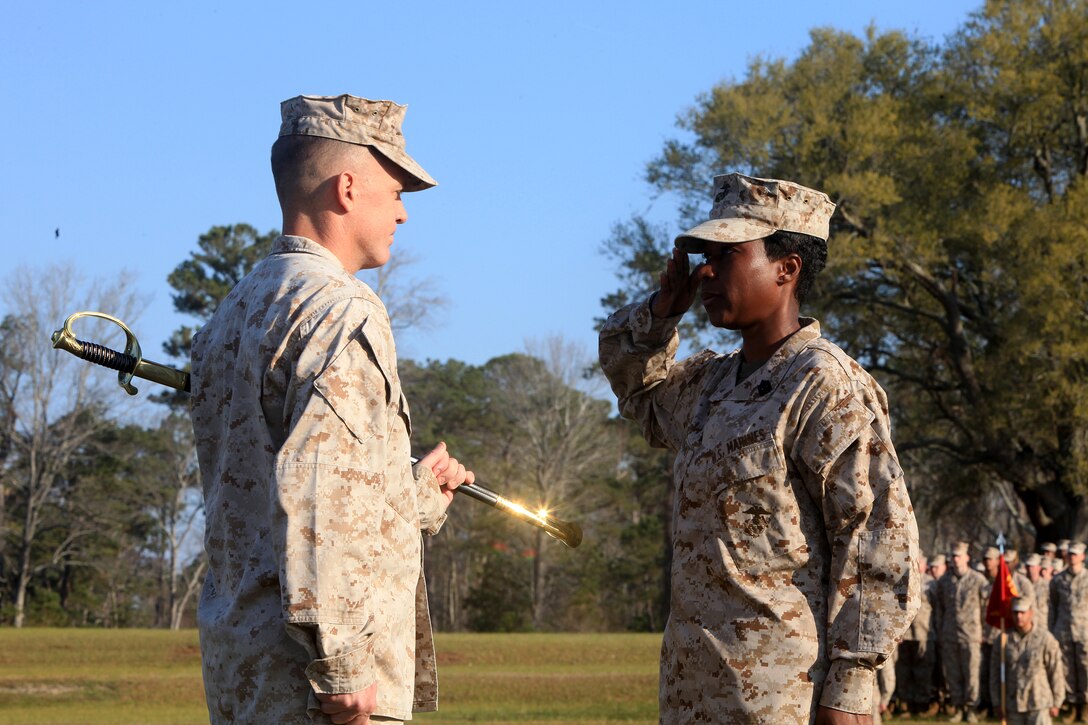 Sgt. Maj. Lanette N. Wright (right), the incoming sergeant major of Combat Logistics Regiment 27, 2nd Marine Logistics Group, salutes Lt. Col. Christopher G. Downs, the commanding officer, during an appointment and relief ceremony aboard Camp Lejeune, N.C., March 15, 2012.  The emblematic Sword of Office was transferred to Wright, signifying the trust placed in the duties and responsibilities as the sergeant major.  (U.S.  Marine Corps photo by Cpl. Katherine M. Solano)
