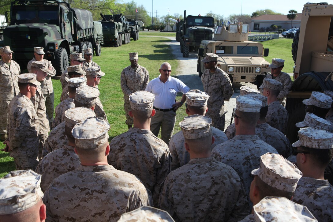Bobby R. Kotlowski (center), a retired Marine Corps sergeant major and the events and volunteer coordinator for Patriots Point Naval and Maritime Museum, welcomes troops with Combat Logistics Battalion 8, 2nd Marine Logistics Group to Charleston Harbor, S.C., March 15, 2012.  The troops had a chance to talk to visitors during a static display about some of the vehicles they operate. (Photo by Cpl. Bruno J. Bego)