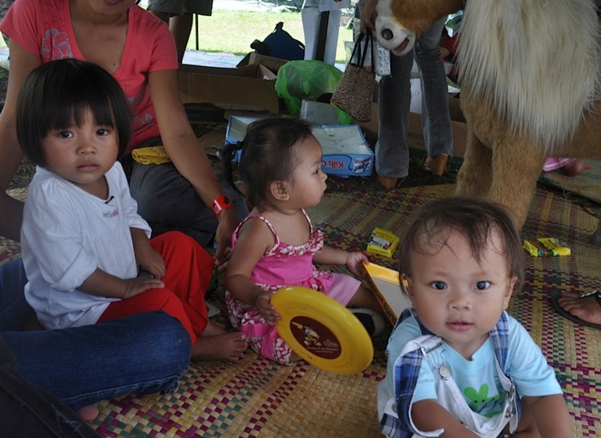Filipino children play in the play tent while their parents receive medical care during Operation Pacific Angel-Philippines on March 10, 2012 in  Legazpi City, Philippines. PACANGEL is a joint and combined humanitarian mission, which kicked off March 5.  More than 8,500 patients were seen during the six-day mission.  The mission included medical, dental, optometry, engineering support and subject-matter expert exchanges with host nation counterparts. Knowledge gained while working alongside host country agencies and militaries, to include non-governmental agencies, can be used during any future humanitarian assistance and disaster relief efforts in the Asia-Pacific region.