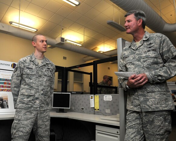 Staff Sgt. Norman Thomson, 9th Communication Squadron, Spectrum Operations Frequency Management, explains to Brig. Gen. David Urich, Director of Communications, Headquarters Air Combat Command, the Spectrum Operations on Beale Air Force Base, Calif., March 14, 2012. Spectrum Operations are responsible more than 200 frequencies assigned to the installation. (U.S. Air Force photo by Airman 1st Class Samuel W. Sanders/Released)