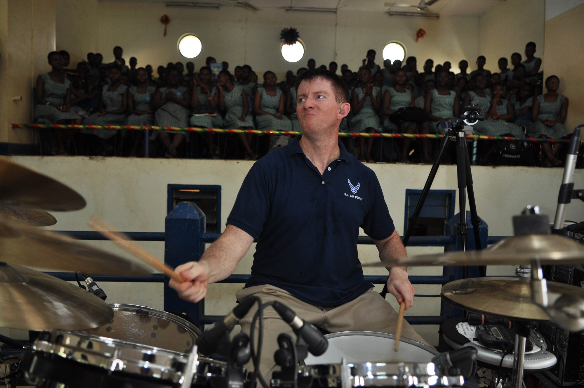ACCRA, Ghana -- Staff Sgt. Robert Browning, U.S. Air Forces in Europe band Touch 'n Go drummer, jams out on the drums during a partnership building performance apart of their tour in support of the African Partnership Flight at the Accra Girls Senior High School March 15 here. This performance is their first of seven community outreach performances in support of the APF. They are traveling throughout Ghana to support the host nation of the APF's countrymen. The APF is a U.S. Air Forces Africa military-to-military event involving the exchange of ideas between U.S., Ghanaian, Benin, Nigerian, Togolese and Sengalese Air Forces. (U.S. Air Force photo by Senior Airman Natasha Stannard/Released)