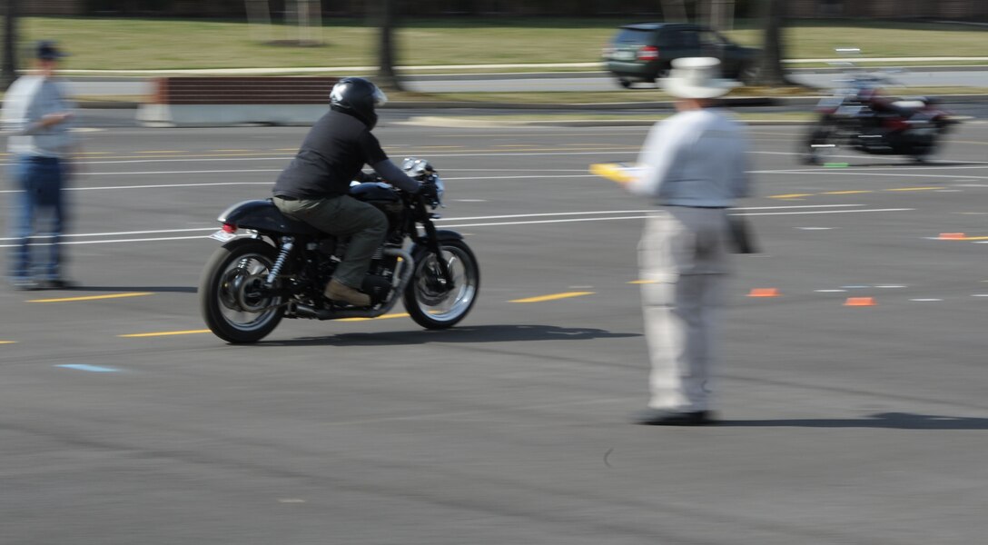 A Team Andrews motorcyclist navigates the road course at a motorcycle safety training course at Joint Base Andrews, Md., on March 15, 2012.  The course is required for motorcyclists who ride on base.  To sign up for the course, log on to https://militarysafepmv.com.  (U.S. Air Force photo/Senior Airman Torey Griffith)(released)
