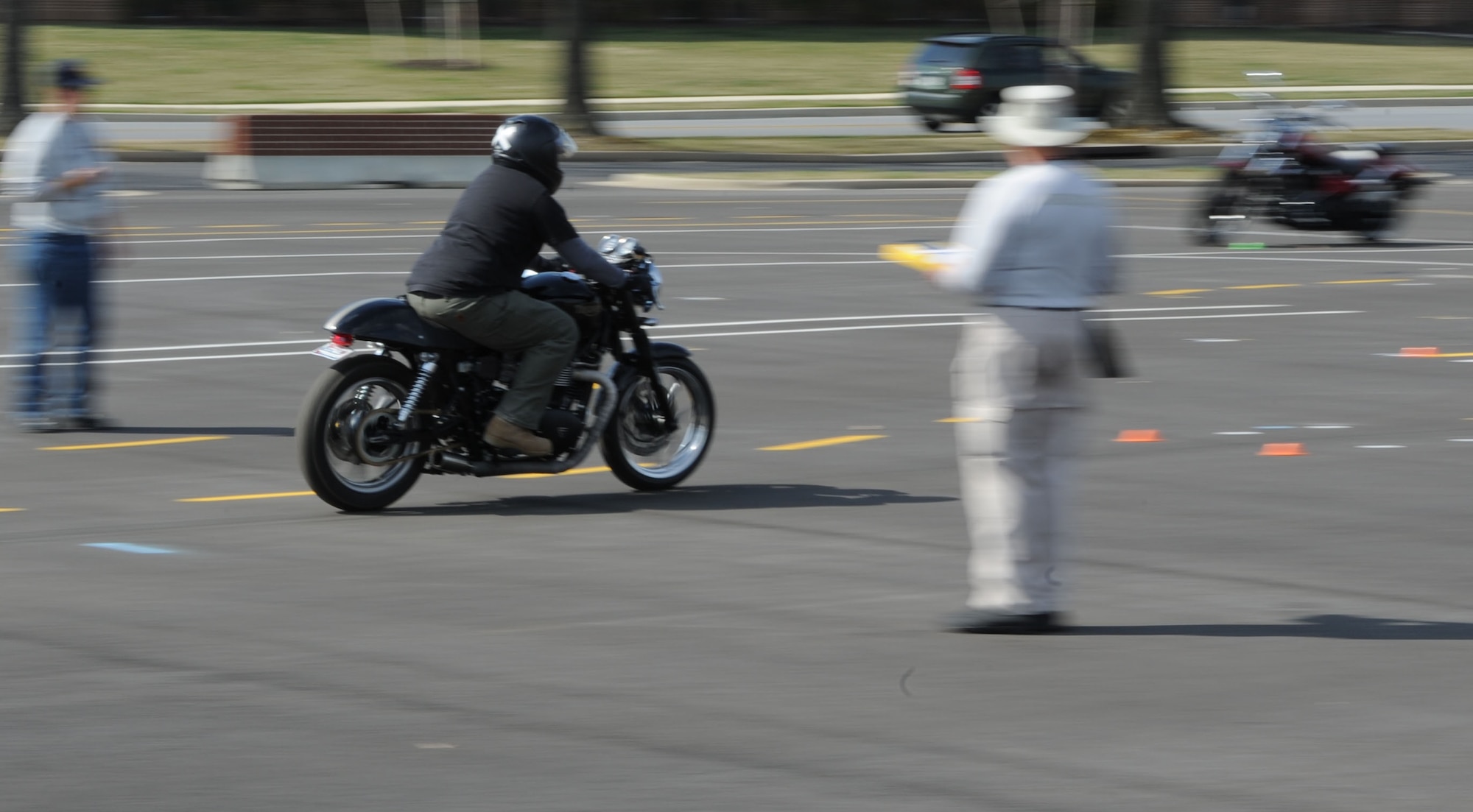 A Team Andrews motorcyclist navigates the road course at a motorcycle safety training course at Joint Base Andrews, Md., on March 15, 2012.  The course is required for motorcyclists who ride on base.  To sign up for the course, log on to https://militarysafepmv.com.  (U.S. Air Force photo/Senior Airman Torey Griffith)(released)