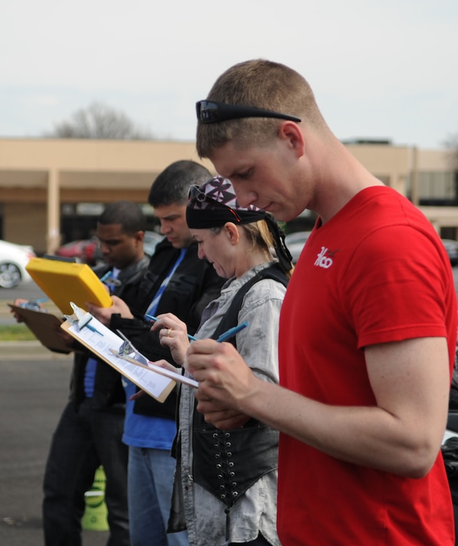 Participants take a written exam before tackling  the riding course at a motorcycle safety training course at Joint Base Andrews, Md., on March 15, 2012.  The course is required for motorcyclists who ride on base.  To sign up for the course, log on to https://militarysafepmv.com.  (U.S. Air Force photo/Senior Airman Torey Griffith)(released)