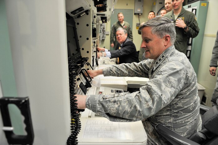 Lt. Gen. William Lord, chief of Warfighting Integration and chief information officer, takes a seat in a missileer's position at the Missile Procedures Trainer and simulates a key turn scenario March 13. Lord toured the base to get a firsthand look at the work that takes place every day to sustain Malmstrom's nuclear mission. (U.S. Air Force photo/Beau Wade)