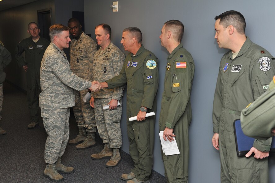 Lord shakes the hands of 341st Operations Group squadron commanders before attending a pre-departure briefing. (U.S. Air Force photo/Beau Wade)