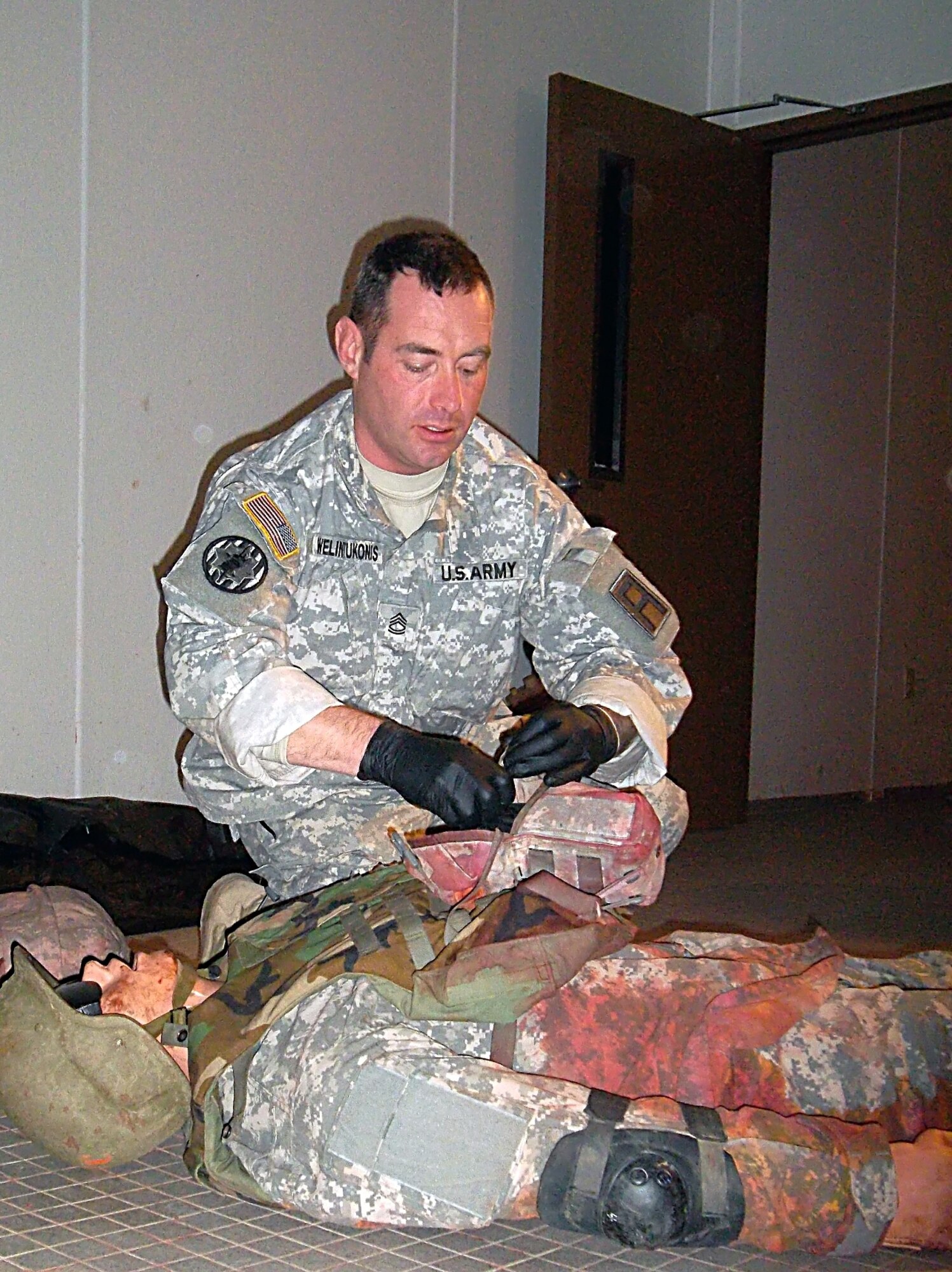 Army Sgt. 1st Class Micah Welintukonis, a combat medic and former Combat Life Saver instructor with 174th Infantry Brigade, First Army Division East, demonstrates proper response procedures on a mock casualty during mobilization training at the Medical Simulation Training Center on Joint Base McGuire-Dix-Lakehurst, N.J., Welintukonis, a native of Coventry, Conn., is preparing for deployment in support of Operation Enduring Freedom. (U.S. Army photo by Sgt. 1st Class Narda Grant/Released)
