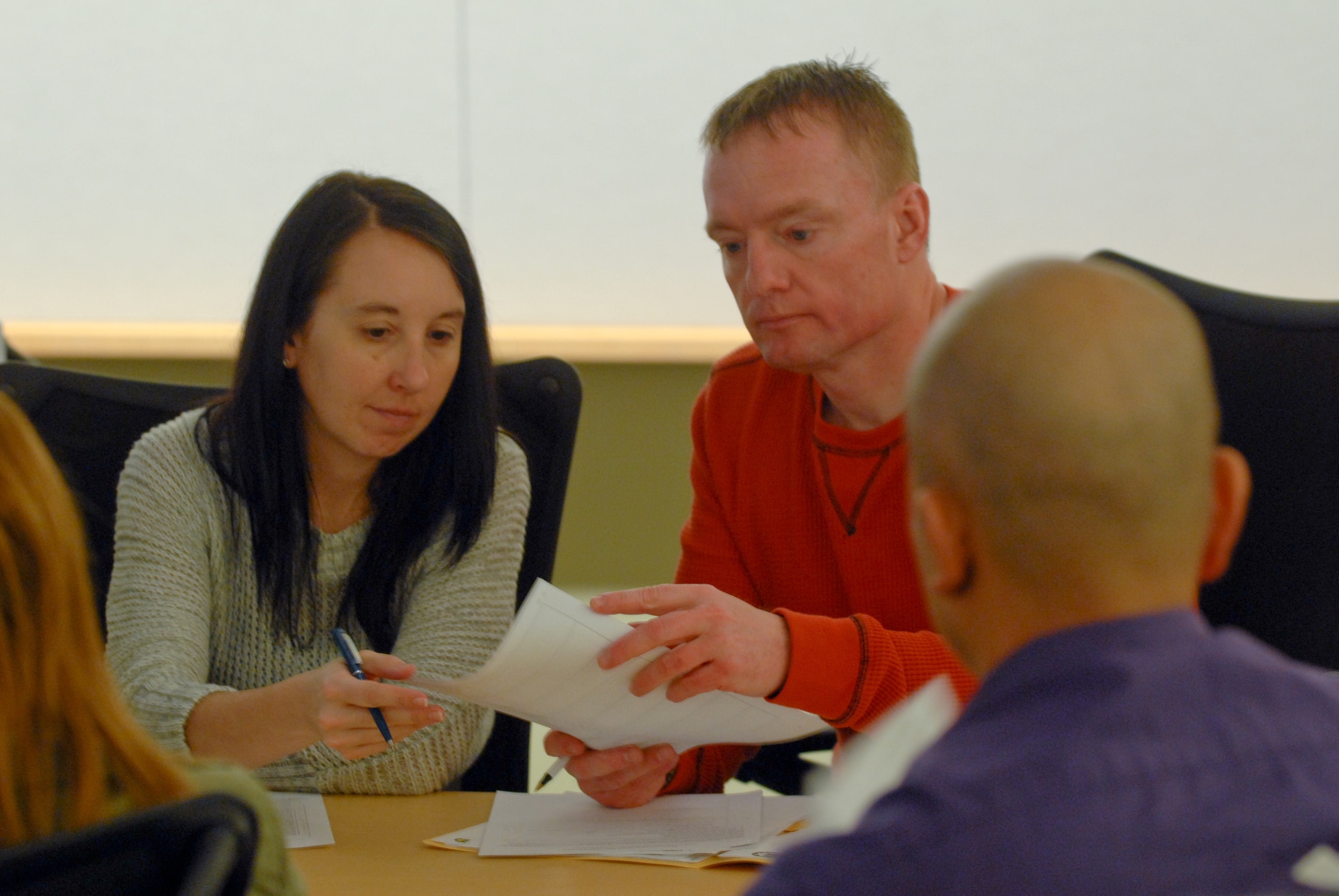 A couple looks over paperwork on resume building during a recent Yellow Ribbon Reintegration event in Niagara Falls, N.Y., hosted by the 99th Regional Support Command March 2 through 4. The Yellow Ribbon program consists of seven events that take place at intervals before and after mobilization, which gives the Soldiers and family members information, counseling skills and techniques for upcoming deployments and re-deployments. For more information about the Yellow Ribbon Program please check out www.arfp.org. (U.S. Army photo by Staff Sgt. Shawn Morris/Released)