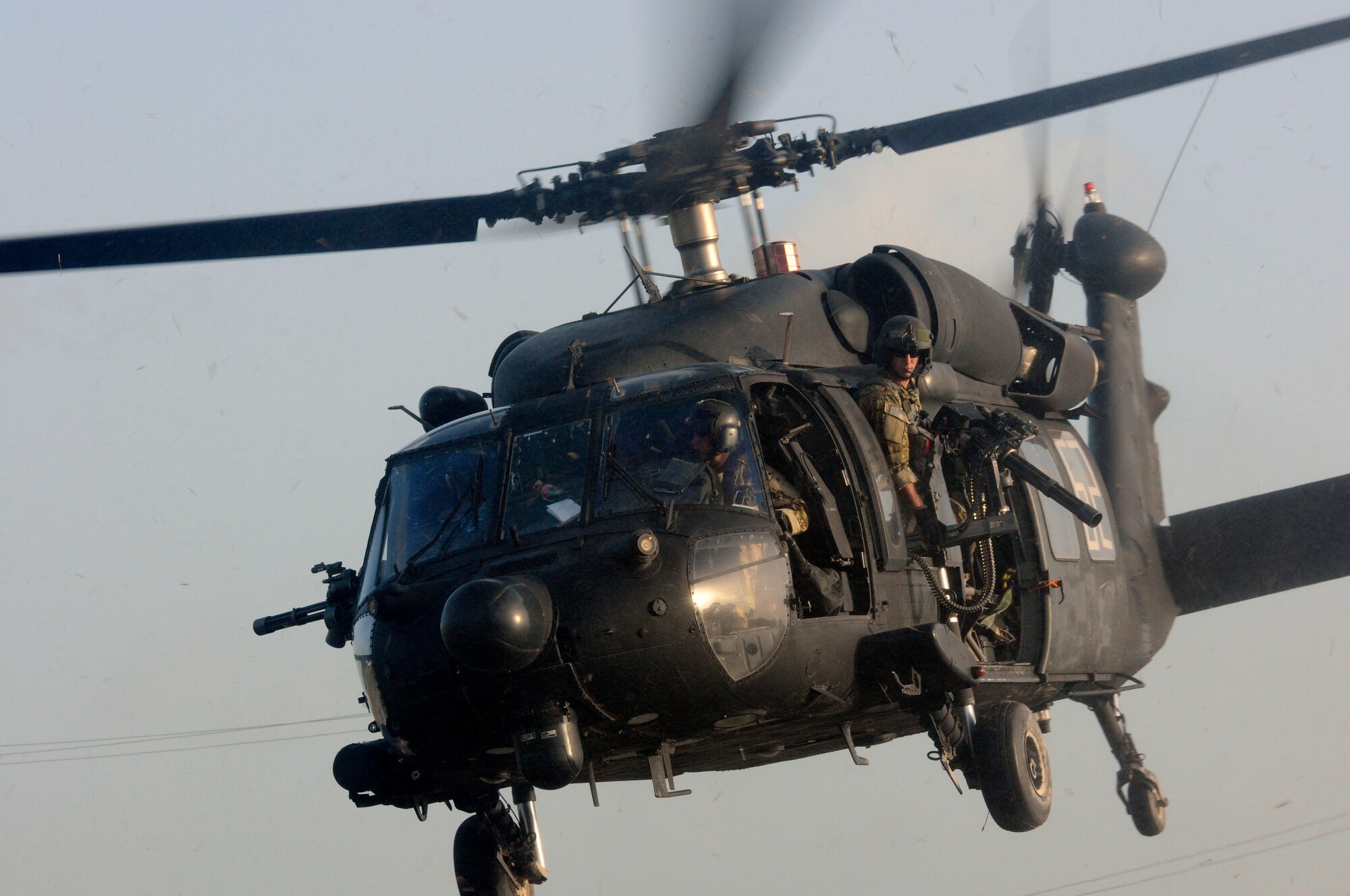 A member of a U.S. Army helicopter crew observes the horizon as they prepare to land on a helipad at Camp Stephenson, Guyana, 25 miles outside of Georgetown, March 8 during a training event in support of Exercise Fused Response 2012. Fused Response is an annual SOUTHCOM-sponsored  multi-lateral exercise involving a combined contingent of U.S. and partner-nation forces.  (U.S. Army photo by Sgt. Taresha D. Neal)