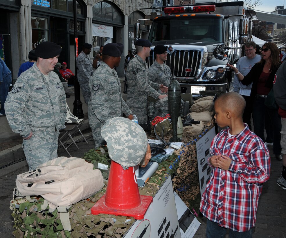 WRIGHT-PATTERSON AIR FORCE BASE, Ohio - Security force members from 88 Security Force Squadron, located at Wright-Patterson Air Force Base, Ohio, demonstrate law enforcement equipment to visitors at the First Four Festival in downtown Dayton's Oregon District on March 11, 2012. (U.S. Air Force photo/Tech. Sgt. Anthony Springer)