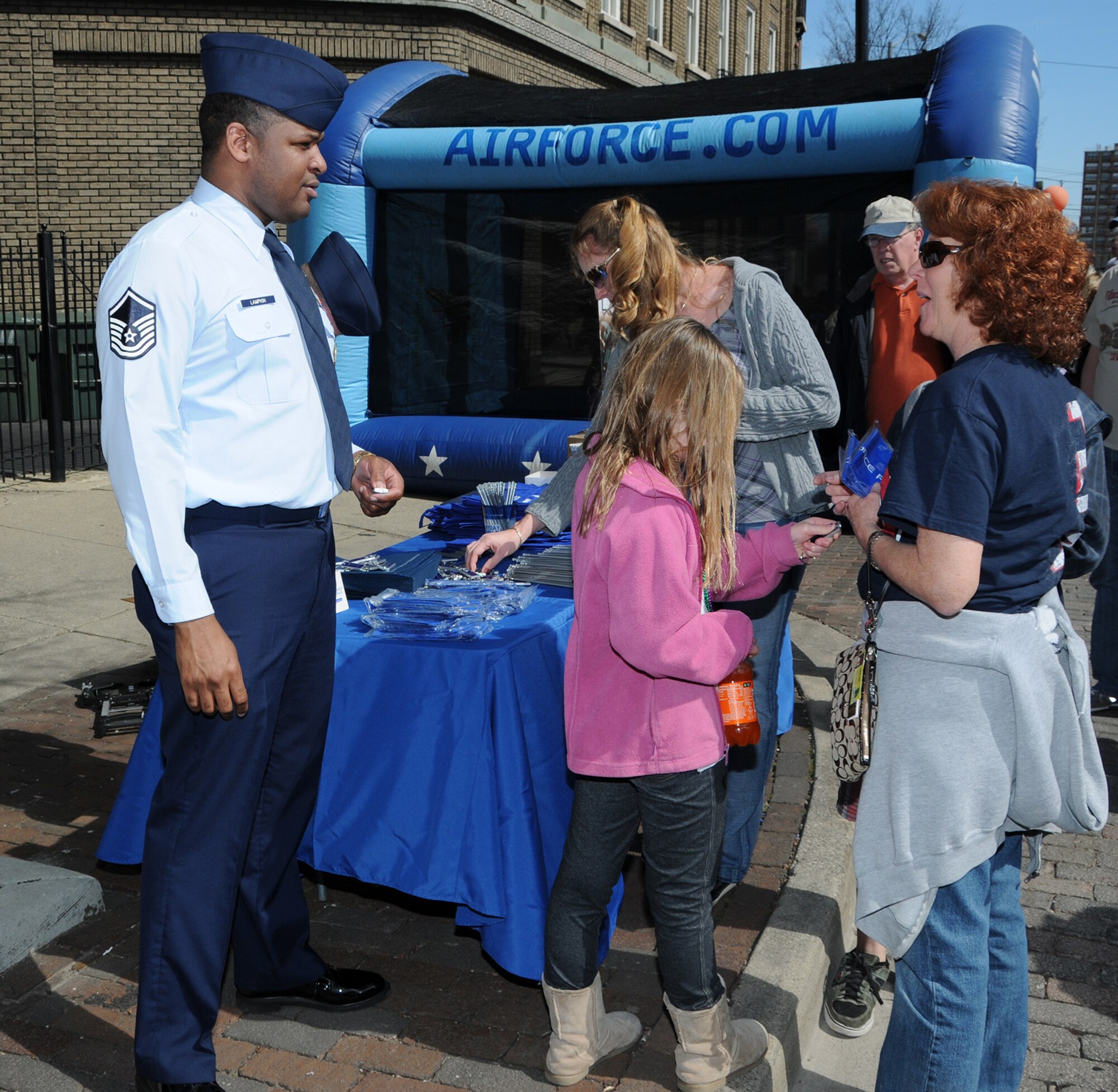 WRIGHT-PATTERSON AIR FORCE BASE, Ohio - Master Sgt. Bobby Lampkin, 445th Reserve Recruiters office, visits with the public during the First Four Festival in downtown Dayton’s Oregon District March 11, 2012. (U.S. Air Force photo/Tech. Sgt. Anthony Springer)