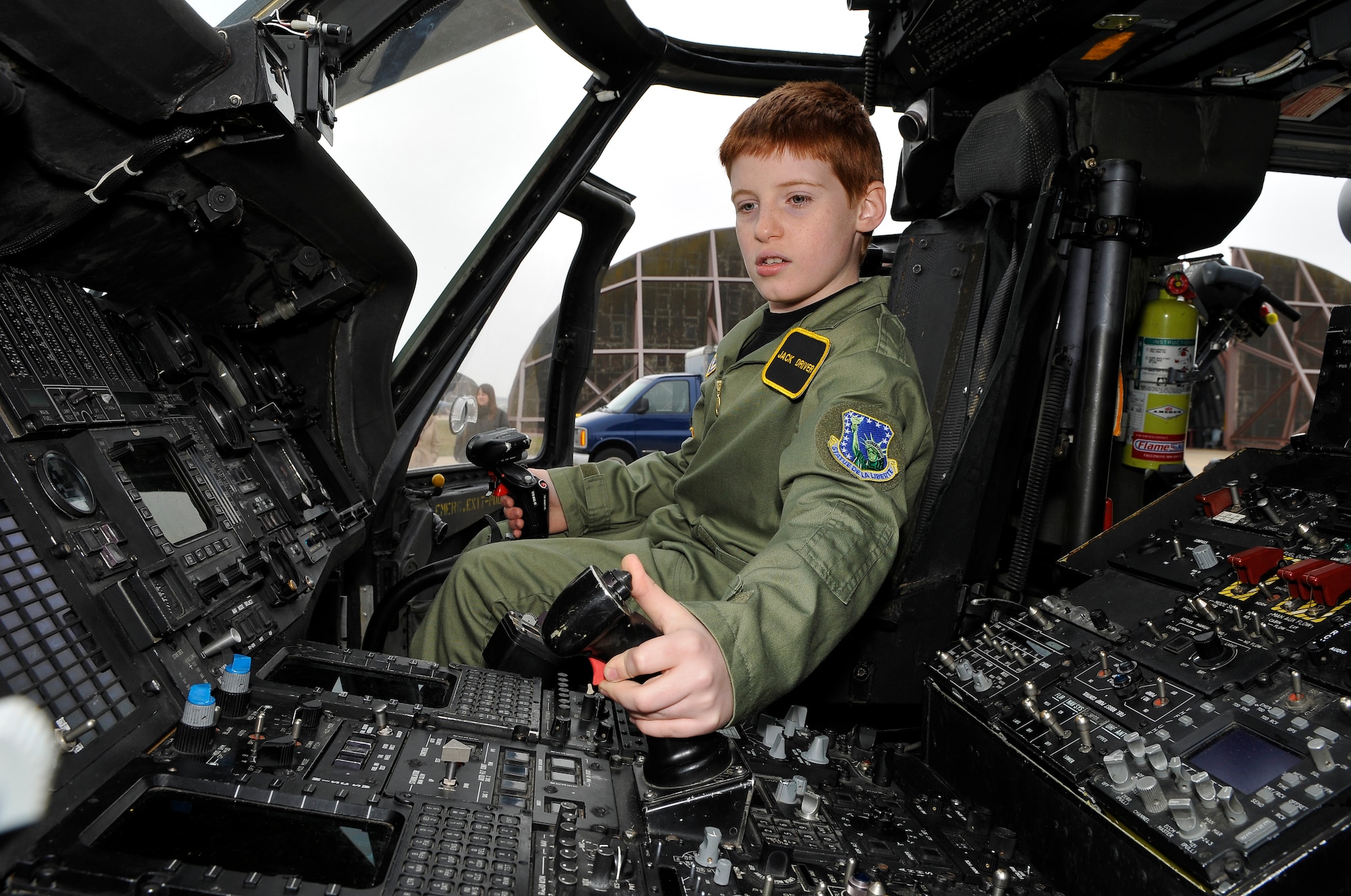 ROYAL AIR FORCE LAKENHEATH, England -- Jack Driver, 10, uses the controls inside an HH-60 Pave Hawk helicopter on the RAF Lakenheath flightline March 14, 2012.  Driver, who suffers from Aplastic Anemia, a rare auto immune disorder where bone marrow fails to make enough blood cells, was selected as a pilot for the day.  The Pilot for a Day program is new to RAF Lakenheath and provides children in the local community, who are fighting life-threatening illnesses or conditions, a day of fun as well as a break from the routine doctor and hospital visits. (U.S. Air Force photo by Staff Sgt. Connor Estes)