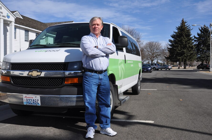 Gerald Johnson, 92nd Civil Engineer Squadron, stands with his Spokane Transit Van in front of the base headquarters March 9. Over the past 11 years, his vanpool has saved more than 1 million miles on personal vehicles. (U.S. Air Force photo by Scott King)
