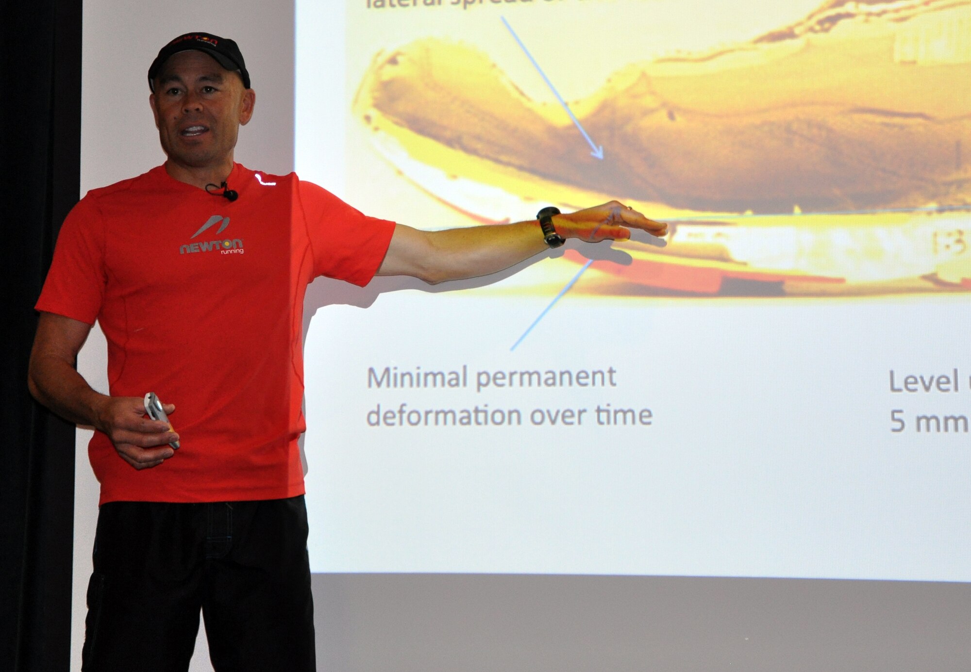 LAUGHLIN AIR FORCE BASE, Texas— Seven-time world champion adventure racer Ian Adamson discusses the characteristics of good running shoes at Club XL here March 13. Adamson hosted a one- and-a-half day clinic to teach attendees the advantages of a natural running gait. (U.S. Air Force photo/2nd Lt. James Ramirez)