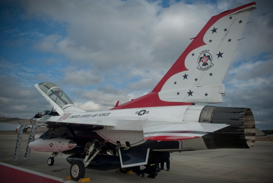 An F-16C/D Fighting Falcon with the U.S. Air Force Thunderbirds demonstration team is inspected post flight after its arrival at Moody Air Force Base. Ga., Feb. 16, 2012. The Thunderbirds will be one of multiple performances during the Legacy of Liberty 2012 airshow, Oct. 27 and 28. (U.S. Air Force photo by Airman 1st Class Nicholas Benroth/Released) 