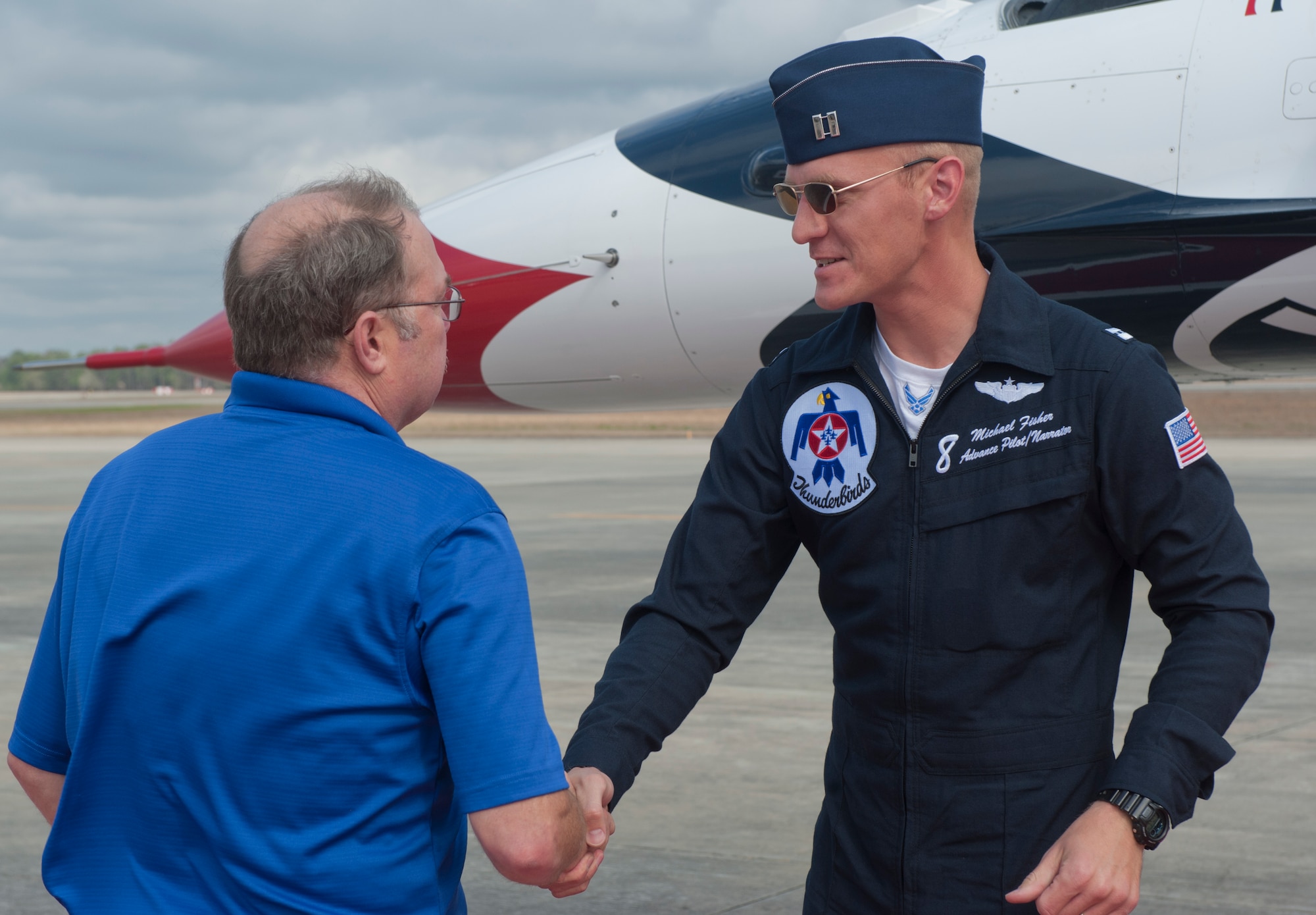 Lee Turner, Legacy of Liberty 2012 airshow advisor greets U.S. Air Force Capt. Michael Fisher, Thunderbird 8 advanced pilot and narrator, after his arrival at Moody Air Force Base. Ga., Feb. 16, 2012. Fisher met with members of the airshow committee during his short visit to Moody. (U.S. Air Force photo by Airman 1st Class Nicholas Benroth/Released)
