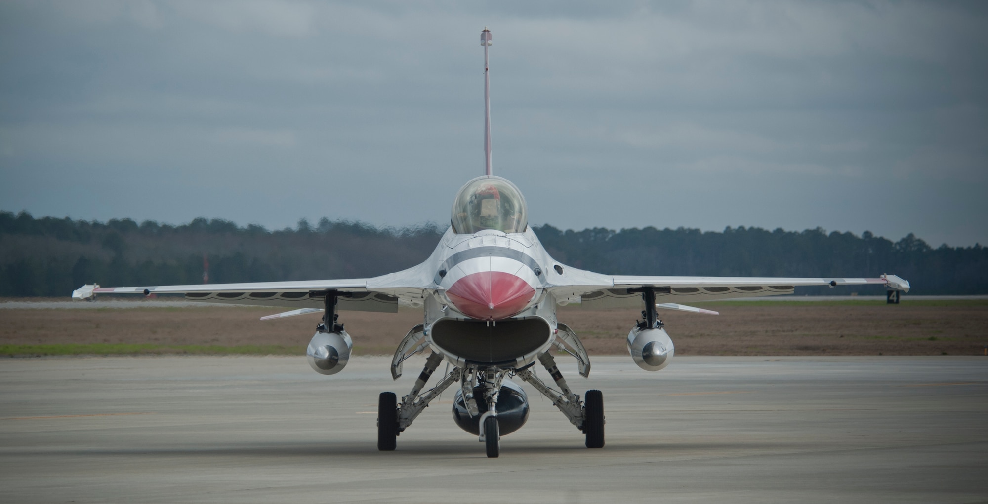 An F-16C/D Fighting Falcon with the U.S. Air Force Thunderbirds team taxis down the runway during a sight survey at Moody Air Force Base. Ga., Feb. 16, 2012. The visit was part of a site survey for their upcoming performance at the Legacy of Liberty 2012 airshow, Oct. 27 and 28. (U.S. Air Force photo by Airman 1st Class Nicholas Benroth/Released)