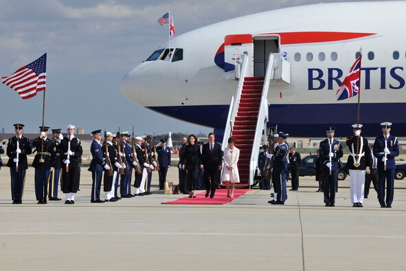 British Prime Minister David Cameron, and his wife Samantha, participate in
arrival ceremonies March 13 on the Joint Base Andrews, Md., flightline.
During his visit, the prime minister met with the president to discuss
boosting economic growth, Iran, Afghanistan and Syria. (U.S. Air Force
photo/Senior Airman Perry Aston)
