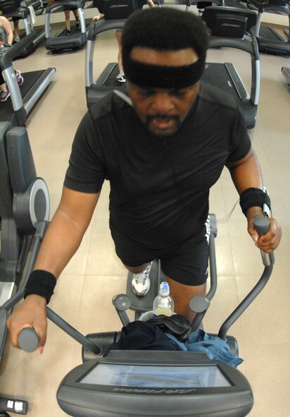 Retired Master Sgt. Larry Johnson works out on an elliptical machine at the fitness center on Barksdale Air Force Base, La., March 14. The elliptical machines were recently added to the cardio area of the fitness center.  (U.S. Air Force photo/Airman 1st Class Joseph A. Pagán Jr.)(RELEASED)