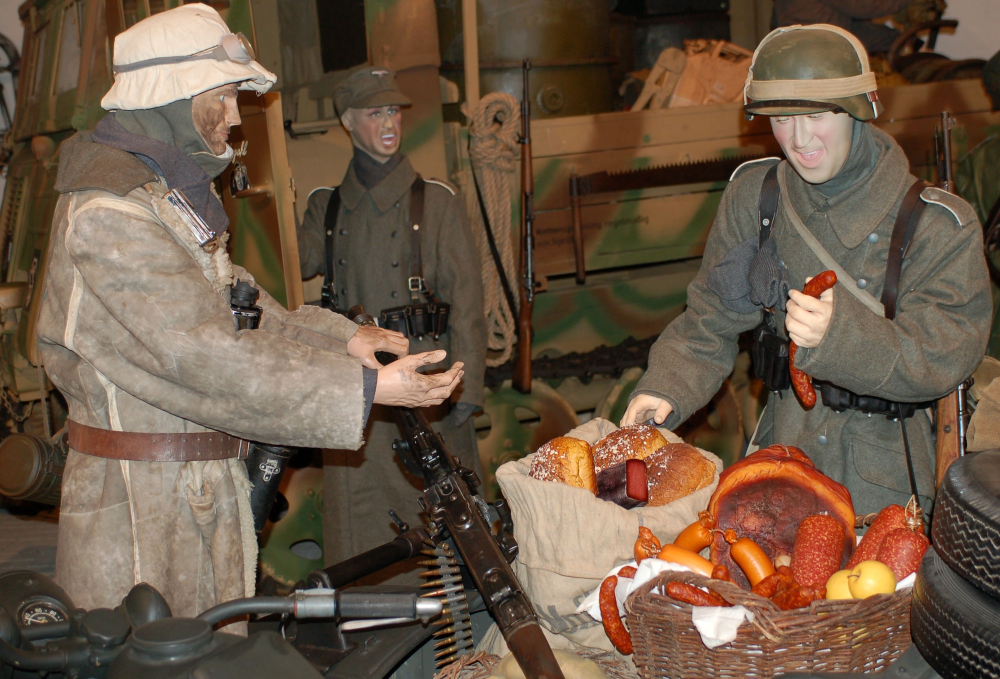 DIERKIRCH, Luxembourg - This diorama scene, located at the National Museum of Military History in Diekirch, Luxembourg, shows how three German soldiers distribute supplementary rations of smoked meat, bread and apples on the frontline after the products arrived in a Zuendapp motorcycle with sidecar. A series of large-scale life-size dioramas, thematic exhibits, weaponry, vehicles, countless original photographs and many personal artifacts tell the story of the liberation of Luxembourg by the United States and allied forces in 1944-45 as well as the history of the “Battle of the Bulge,” at the museum. (U.S. Air Force photo by Iris Reiff/released)