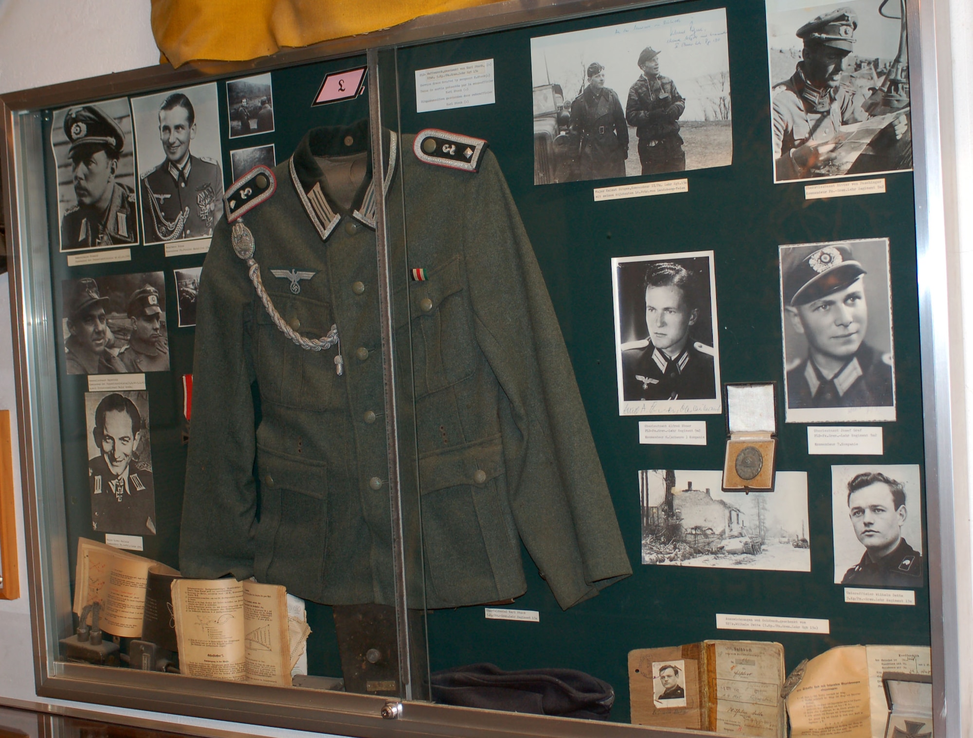 DIERKIRCH, Luxembourg - The personal uniform and artifacts donated by a German survivor of the "Bulge," then a member of the elite "Panzerlehrdivision" which is an armored division are displayed at the National Museum of Military History in Diekirch, Luxembourg. A series of large-scale life-size dioramas, thematic exhibits, weaponry, vehicles, countless original photographs and many personal artifacts tell the story of the liberation of Luxembourg by the United States and allied forces in 1944-45 as well as the history of the “Battle of the Bulge,” at the museum. (U.S. Air Force photo by Iris Reiff/released)