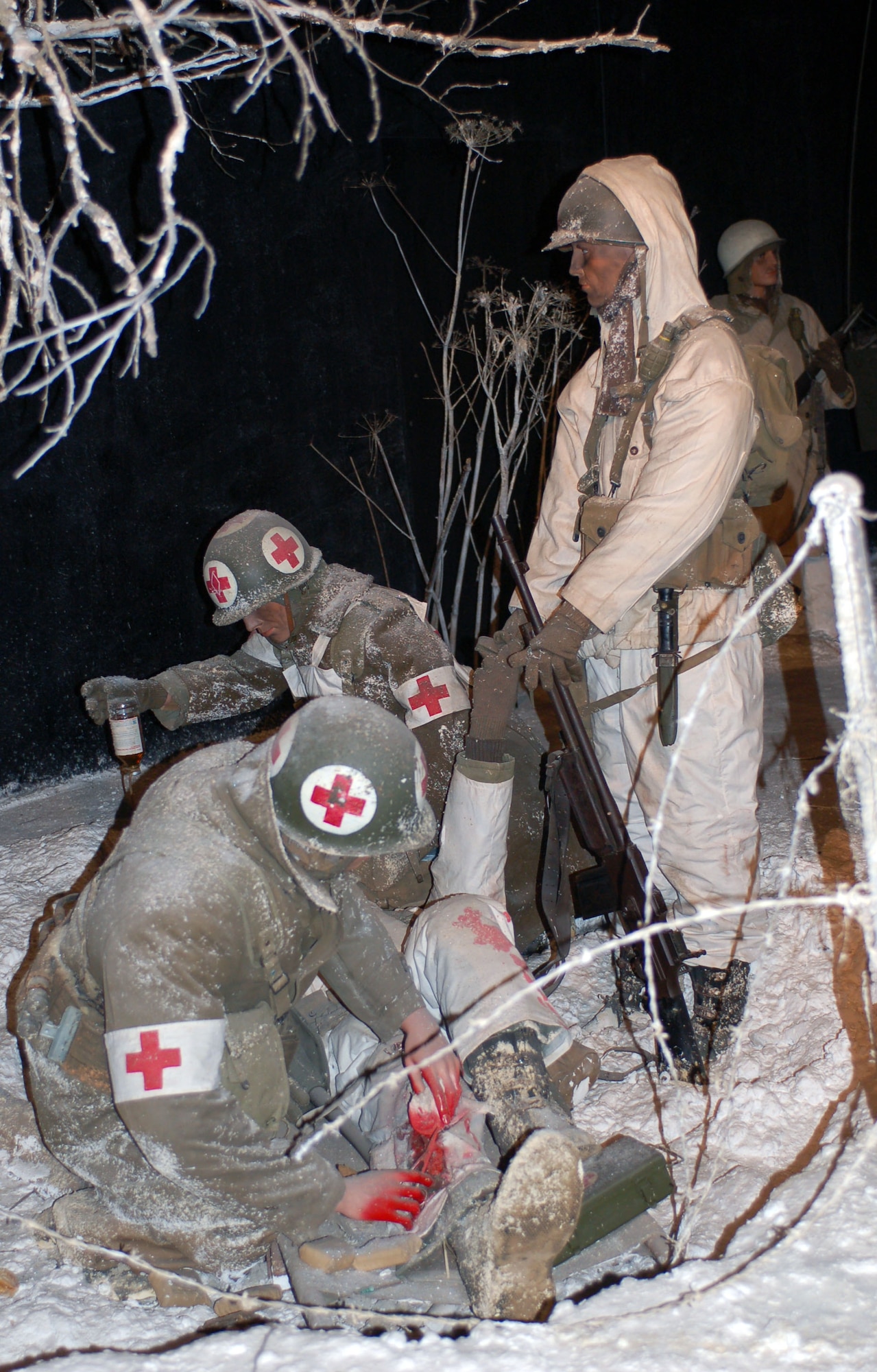 DIERKIRCH, Luxembourg - This diorama scene, located at the National Museum of Military History in Diekirch, Luxembourg, shows two U.S. Army medics giving plasma to a wounded service member of the 5th U.S. Infantry Division "Red Diamond" during the Jan. 18-20, 1945 Sauer river crossing operations in Diekirch. A series of large-scale life-size dioramas, thematic exhibits, weaponry, vehicles, countless original photographs and many personal artifacts tell the story of the liberation by the United States and allied forces of Luxembourg in 1944-45 as well as the history of the “Battle of the Bulge,” at the museum. (U.S. Air Force photo by Iris Reiff/released)