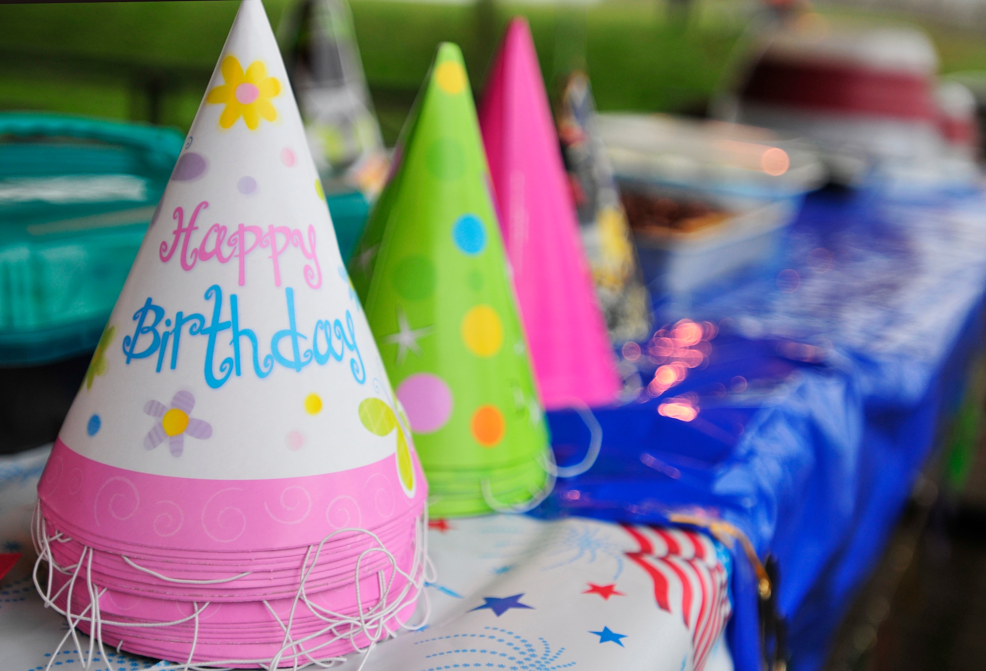 ROYAL AIR FORCE LAKENHEATH, England - Birthday hats are set on a table for the 100th birthday of the Girl Scouts' at Defender's Park March 12, 2012. The event, planned by the members of Anglia Brownie Troop 43, included a group sing-along, friendship circle, cupcakes and fun. (U.S. Air Force photo by Senior Airman Tiffany M. Deuel)