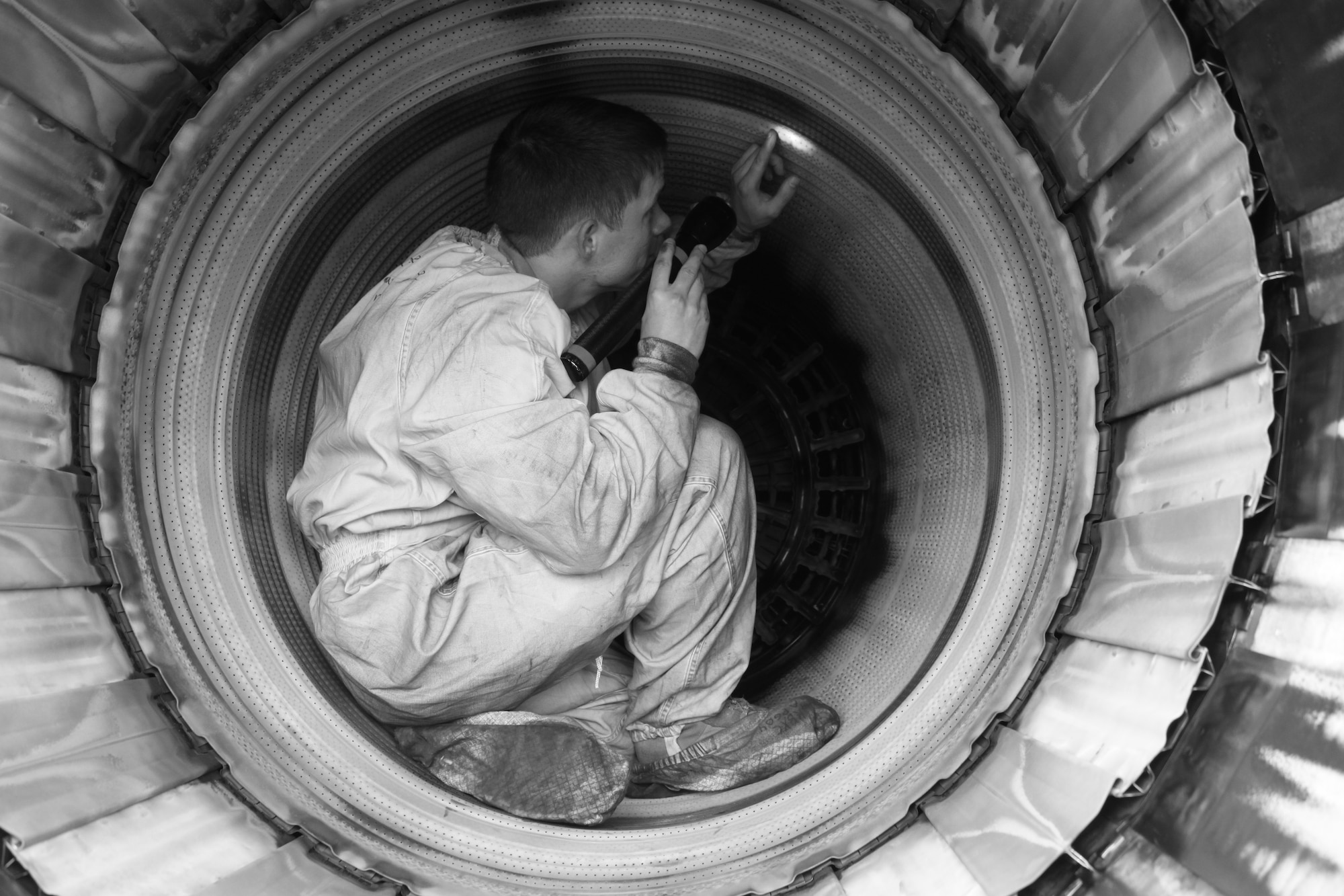 U.S. Air Force Staff Sgt. Jonah Love, 44th Aircraft Maintenance Unit, inspects a U.S. Air Force F-15 Eagle fighter jet engine during local operational readiness exercise Beverly High 12-3 on Kadena Air Base, Japan, March 13, 2012. Safety inspections are done daily to ensure pilots and crew will be safe during any training or real world missions. (U.S. Air Force photo by Maj. John M. Jacobus/Released)