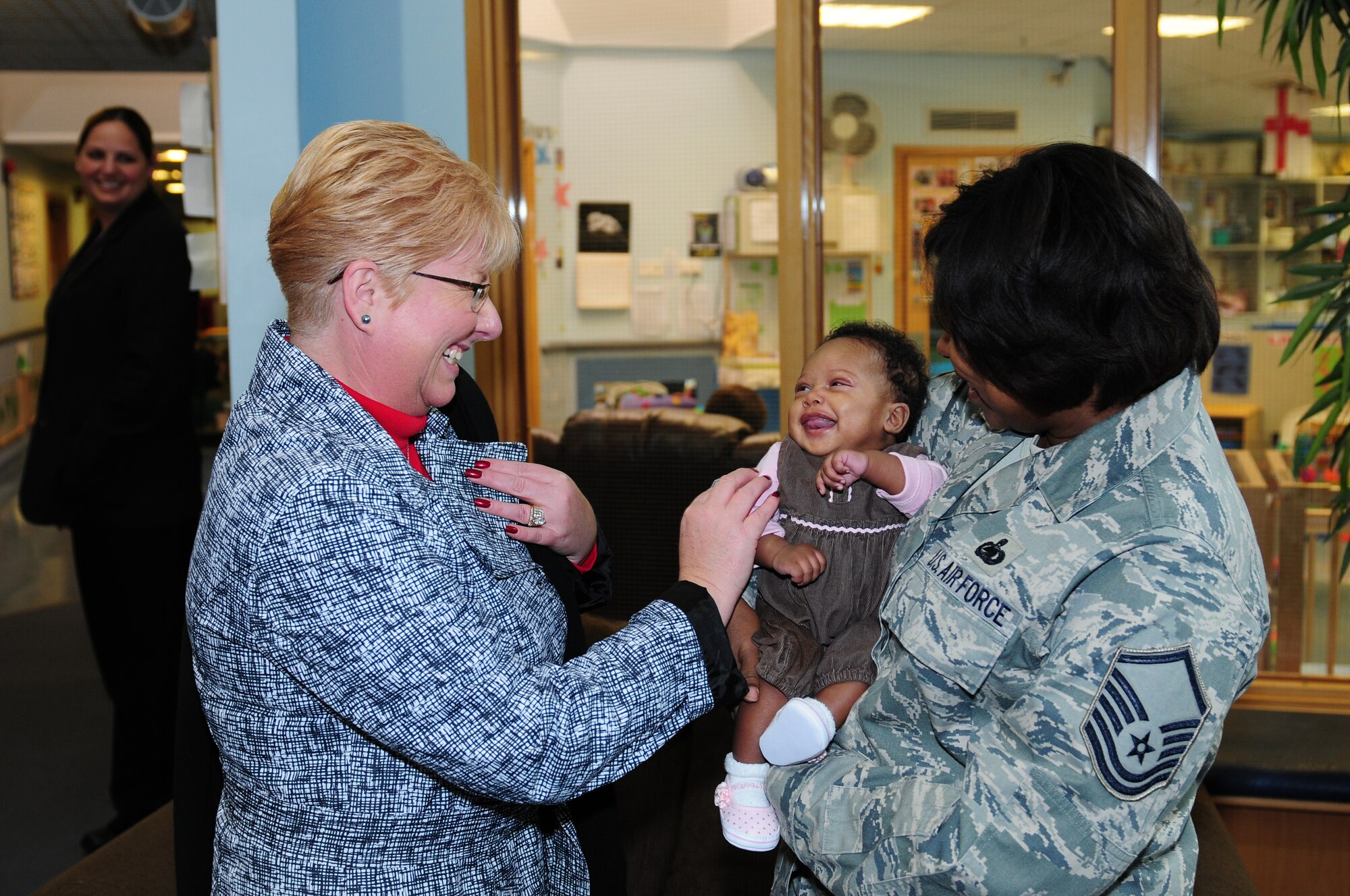 ROYAL AIR FORCE LAKENHEATH, England – Paula Roy, wife of Chief Master Sgt. of the Air Force James Roy, greets Master Sgt. Sheva Quinn, 48th Logistics Readiness Squadron asset management superintendent, and her three-month-old daughter Aniah, March 13, 2012. Mrs. Roy took a tour of Lakenheath support facilities to see how the 48th Fighter Wing takes care of Airmen and families. (U.S. Air Force photo by Airman 1st Class Cory D. Payne)