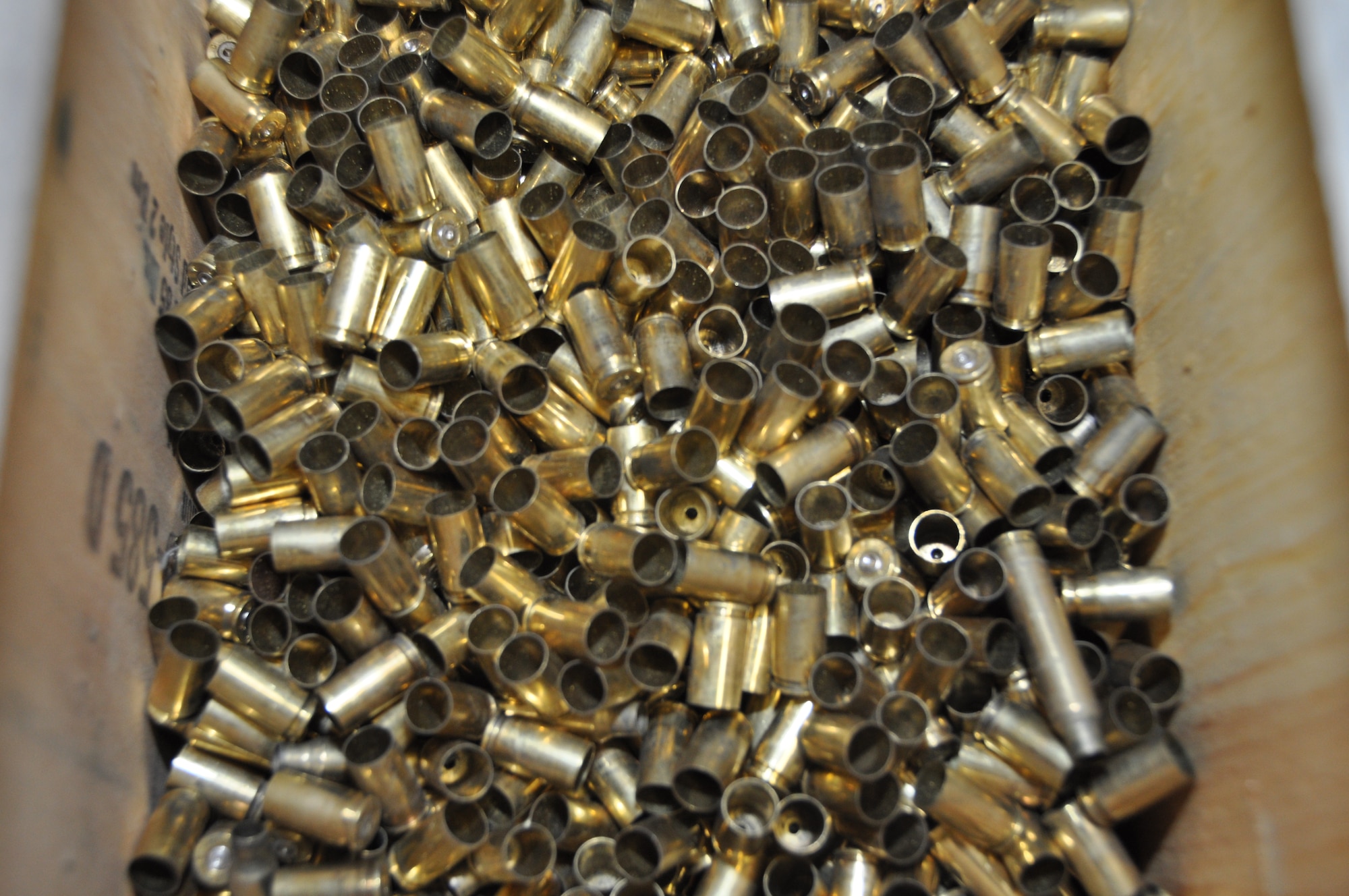 Hundreds of empty cartridges fill containers after an M-9 qualification class at Osan Air Base, Republic of Korea, March 13, 2012. (U.S. Air Force photo/Airman 1st Class Michael Battles)