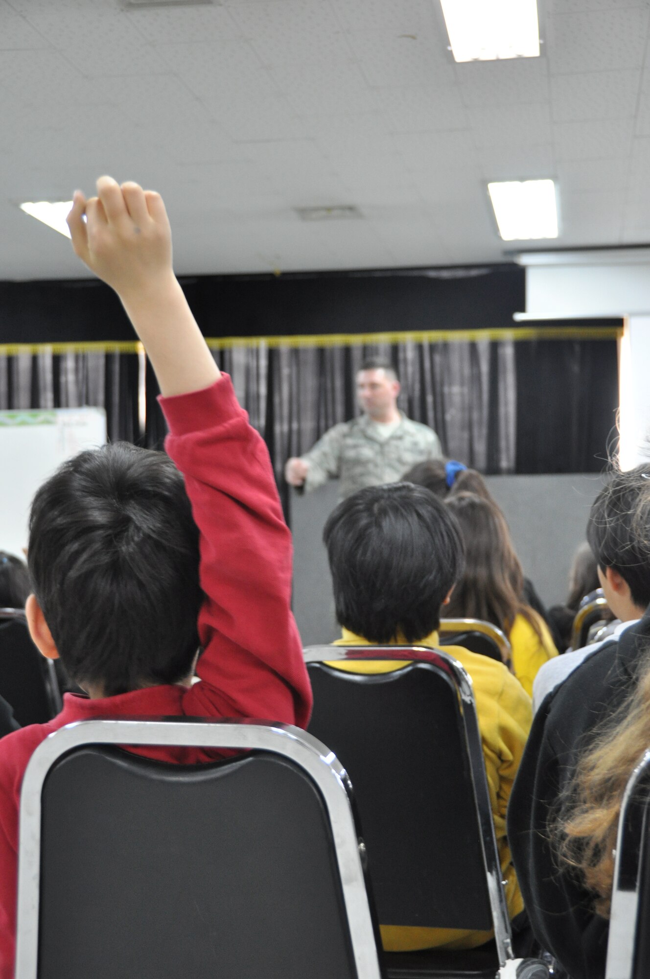 A local Korean student asks Master Sgt. Joshua Ashton 51st Civil Engineer Squadron firefighter, a question during the question and answer section of a safety class March 9, 2012. (U.S. Air Force photo/ Staff Sgt. Stefanie Torres)
