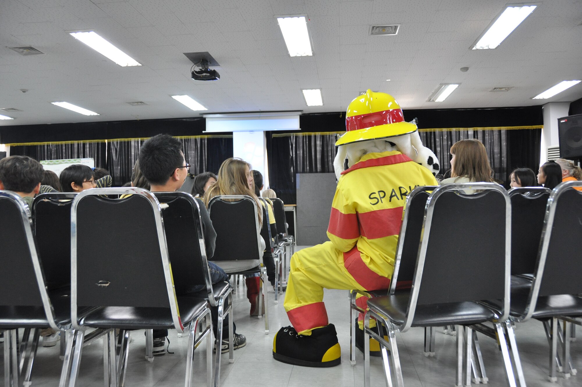 Sparky, the mascot for fire safety, joins local Korean students during a safety class taught by 51st Civil Engineer Squadron firefighters March 9, 2012. (U.S. Air Force photo/ Staff Sgt. Stefanie Torres)