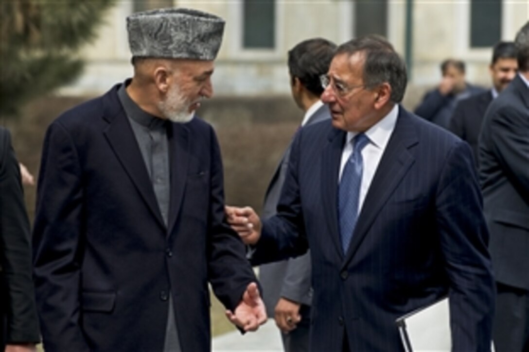 U.S. Defense Secretary Leon E. Panetta speaks with Afghan President Hamid Karzi after counterpart talks in Kabul, Afghanistan, March 15, 2012.