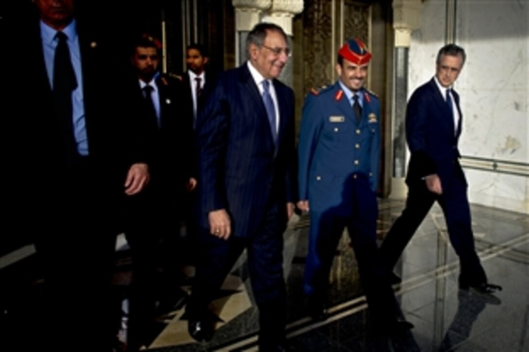 U.S. Defense Secretary Leon E. Panetta walks with United Arab Emirates Maj. Gen. Rashad Mohamed S. AlSaddi and Deputy Chief of Mission L. Victor Hurtado in Abu Dhabi, United Arab Emirates, March 15, 2012.