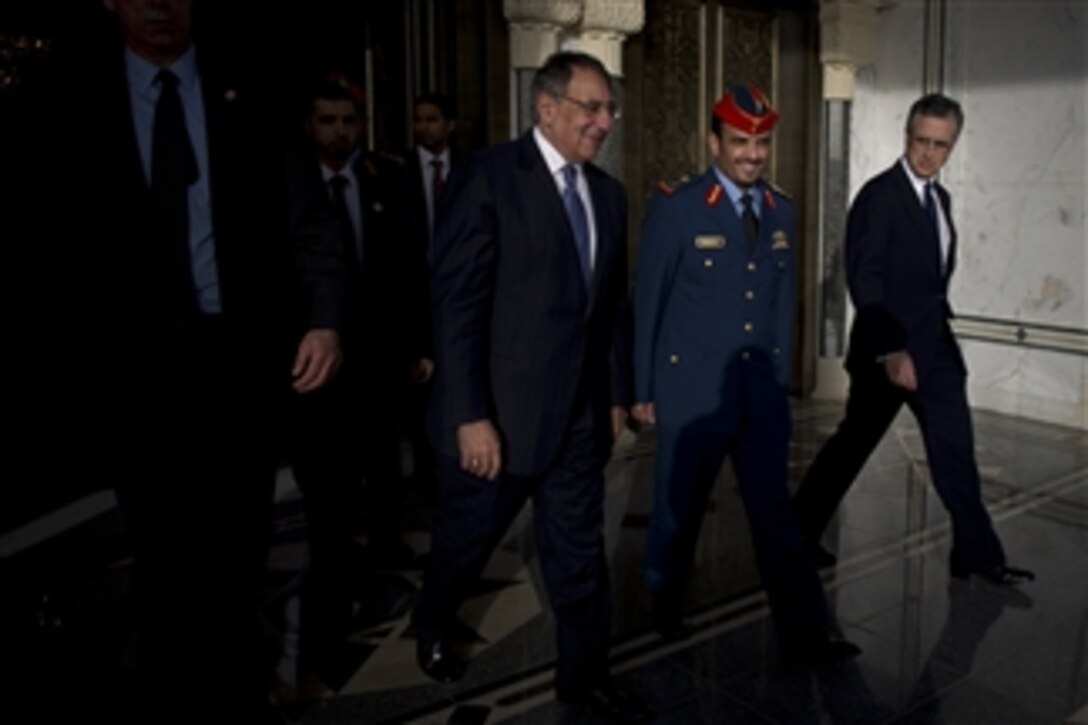 Secretary of Defense Leon E. Panetta is escorted to his car by United Arab Emirates Armed Forces Chief of Staff Hamad Mohammad Thani Al Rumaithi and Deputy Chief of Mission L. Victor Hurtado in Abu Dhabi, United Arab Emirates, on March 15, 2012.  