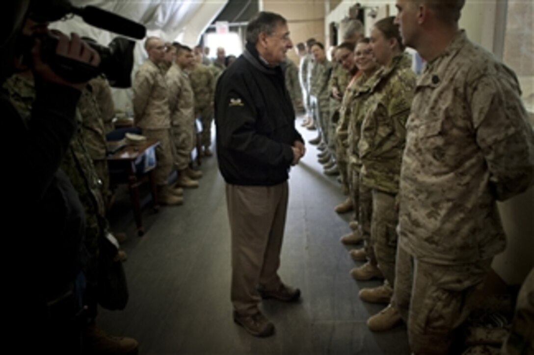 Secretary of Defense Leon E. Panetta greets service members transiting into or out of Afghanistan at the Manas Air Base Transit Center, Kyrgyzstan, on March 14, 2012.  Panetta met with counterparts and troops during his visit in the country.   