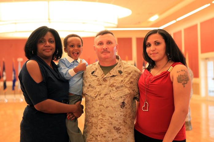 The Wrench family, from left, wife Jo Ann, grandson Isaiah, Herbert Wayne, and daughter Ashley, pose for a photo following Wrench’s retirement as sergeant major of 2nd Marine Logistics Group aboard Camp Lejeune, N.C., March 16, 2012.  Wrench and his wife have been married since 1986, and he says she is the “backbone” of his career and his life.  (U.S. Marine Corps photo by Cpl. Katherine M. Solano)