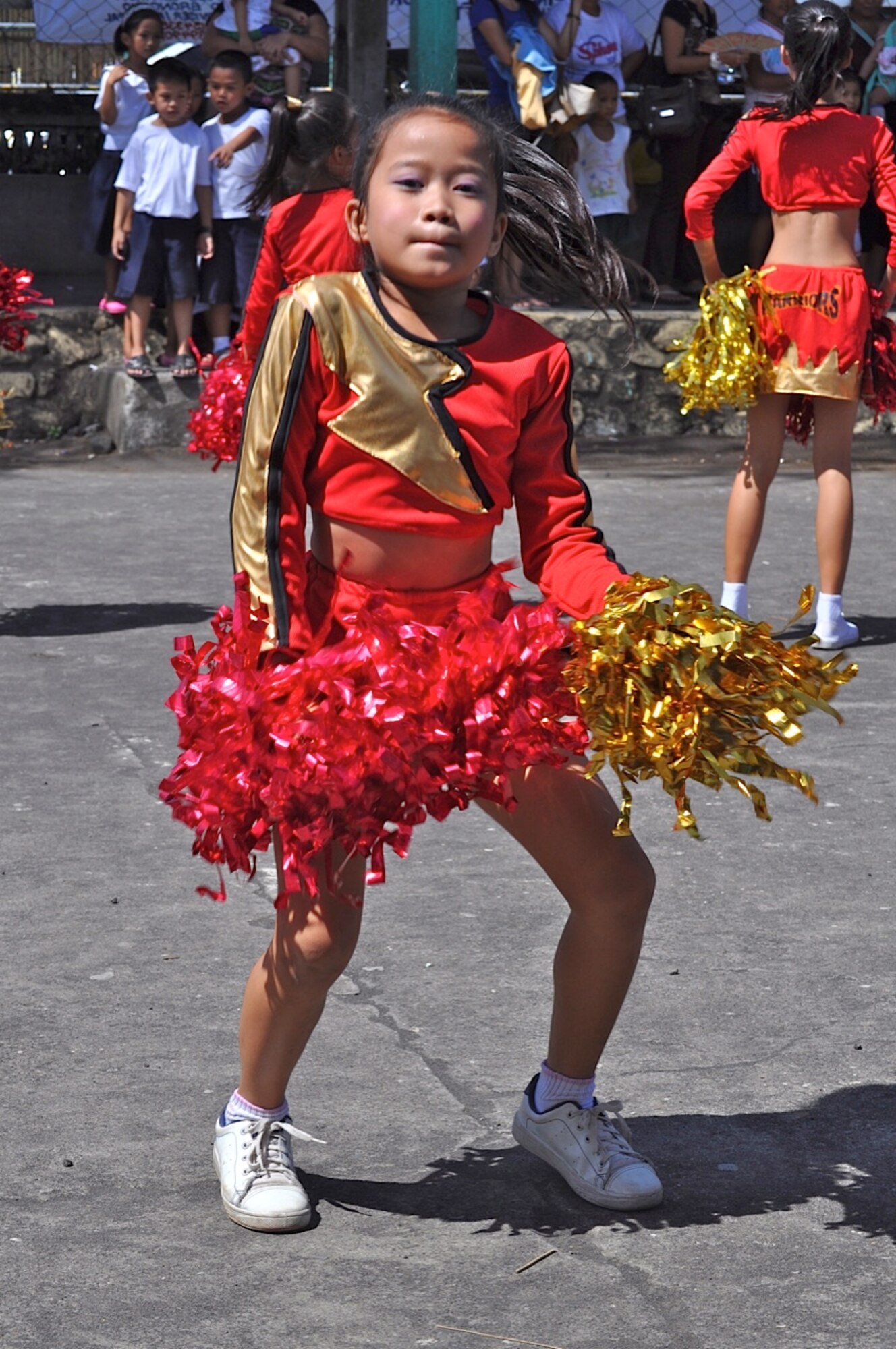 A student from the Warriors from Binitayan Elementary School, Legazpi City,
Philippines, performs a dance number as a thank you to U.S. and Philippine
forces' engineers March 12, 2012. The engineers rebuilt three classrooms at
the school during Operation Pacific Angel-Philippines March 5 to 10.
PACANGEL is a joint and combined humanitarian mission. The mission included
medical, dental, optometry, engineering support and subject-matter expert
exchanges. (U.S. Air Force photo/Master Sgt. Allison Day)
