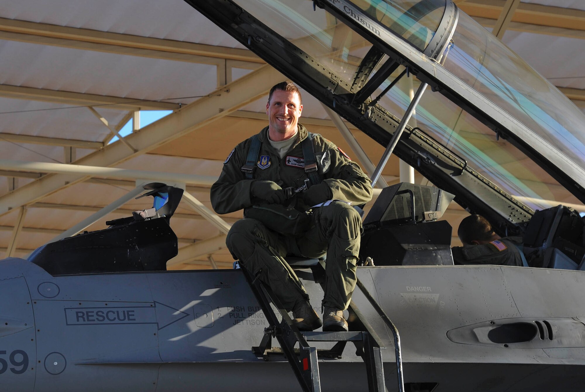 Maj. Saxon Yandell, 69th Fighter Squadron Assistant Director of Operations, reached his 3000th F-16 flying hour on Mar. 15. His family and fellow pilots were on the flight line waiting to greet him with water hoses and congratulations after his flight. Yandell has been flying for over 15 years.  (U.S. Air Force photo by Staff Sgt. Darlene Seltmann)
