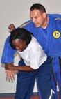 Kaylin Walker attempts to take down judo fitness instructor Roy Eby during Monday’s Judo Fitness Class at the Chaparral Fitness Center. (U.S. Air Force photo/Christina Coulson)