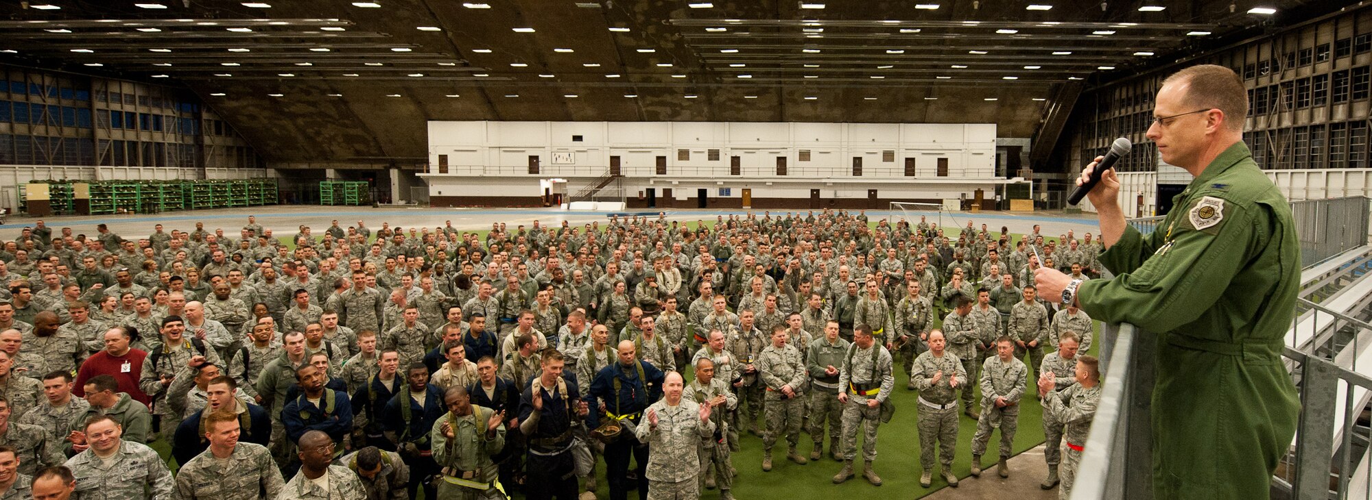 Airmen of the 28th Bomb Wing fill the Pride Hangar, March 16, 2012, as Col. Mark Weatherington, 28th Bomb Wing commander, announces both the end of an Operational Readiness Exercise, and the cancellation of the upcoming ORE and Operational Readiness Inspection at Ellsworth Air Force Base, S.D. Weatherington thanked the Airmen for their hard work and added that the base will implement a routine battle rhythm as a way of maintaining a high level of readiness. (U.S. Air Force photo by Airman 1st Class Kate Thornton/Released) 