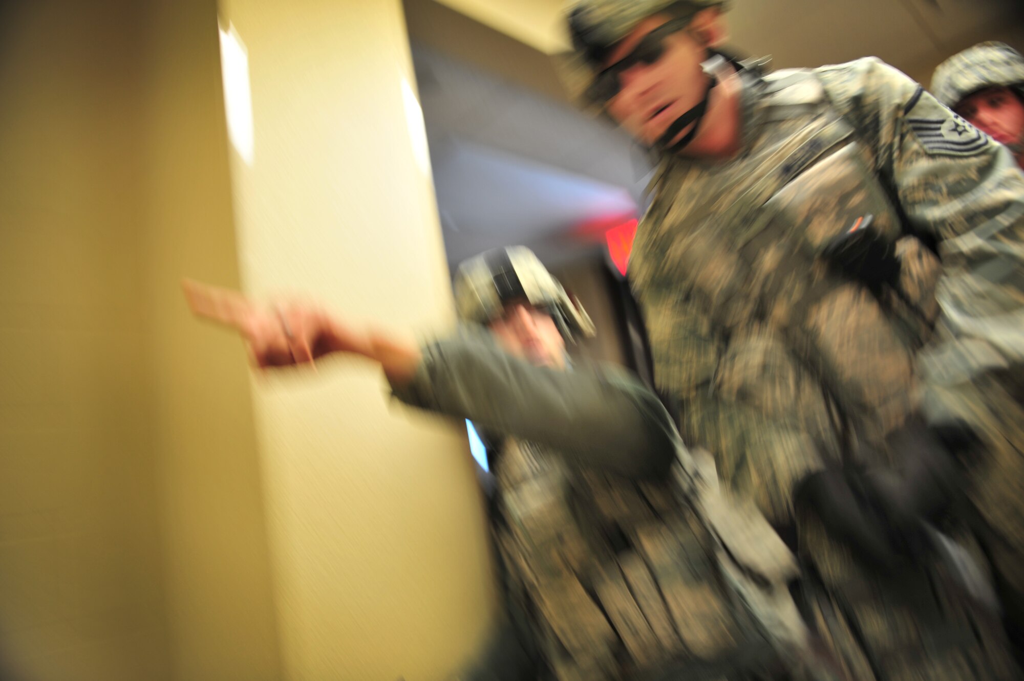 U.S. Air Force Master Sgt. Robert Wilson, 27th Special Operations Security Forces Squadron, moves forward to clear a building during an active shooter training scenario at Cannon Air Force Base, N.M., March 1, 2012. Training scenarios provide a safe and controlled environment to practice different tactics, techniques and procedures. (U.S. Air Force photo by Tech. Sgt. Josef Cole)